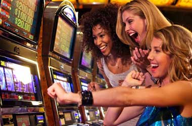 group of women winning the jackpot on a slot machine
